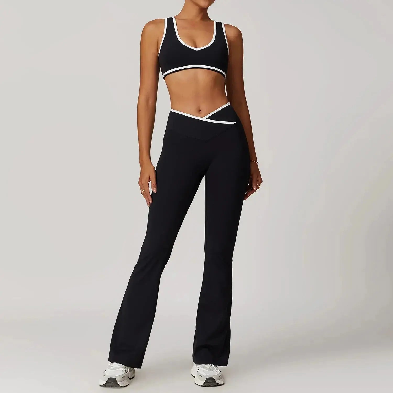 Women’s high waist yoga set by Hypes Inventory, featuring a matching cross-design sports bra and leggings for fitness workouts.