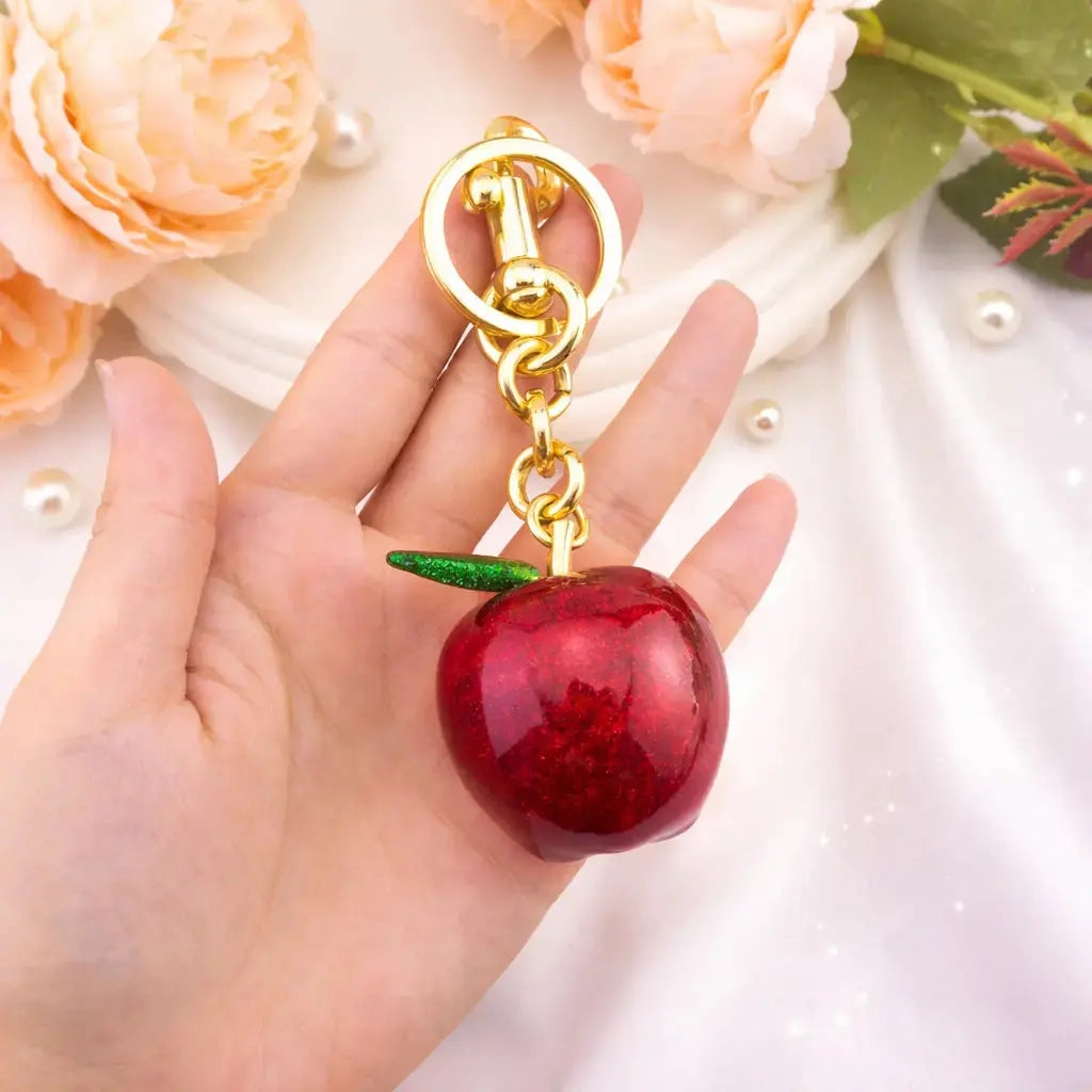 Apple-shaped keychain bag charm by Hypes Inventory, cute and aesthetic purse accessory for women to decorate handbags.