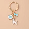 Cute enamel cartoon dog and penguin keychain by Hypes Inventory, featuring heart and star charms for bags and keys.