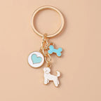 Cute enamel cartoon dog and penguin keychain by Hypes Inventory, featuring heart and star charms for bags and keys.