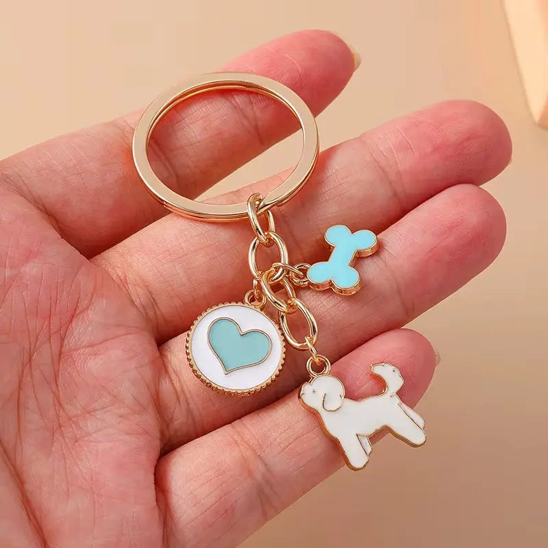 Cute enamel cartoon dog and penguin keychain by Hypes Inventory, ideal for keys and bags with heart and star designs.