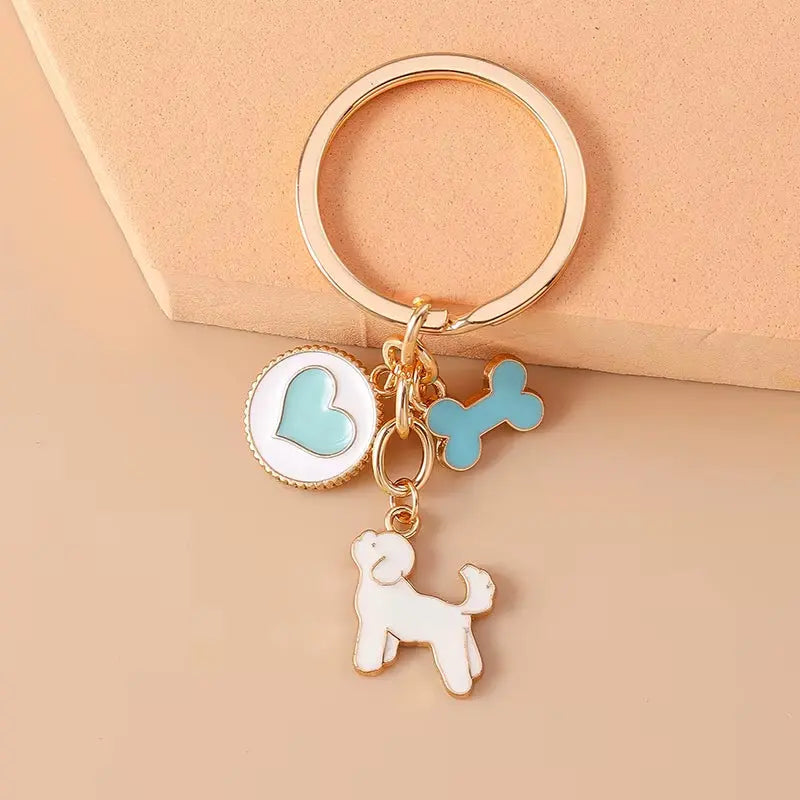 Cute enamel cartoon dog and penguin keychain by Hypes Inventory, featuring heart and star charms for bags and keys.