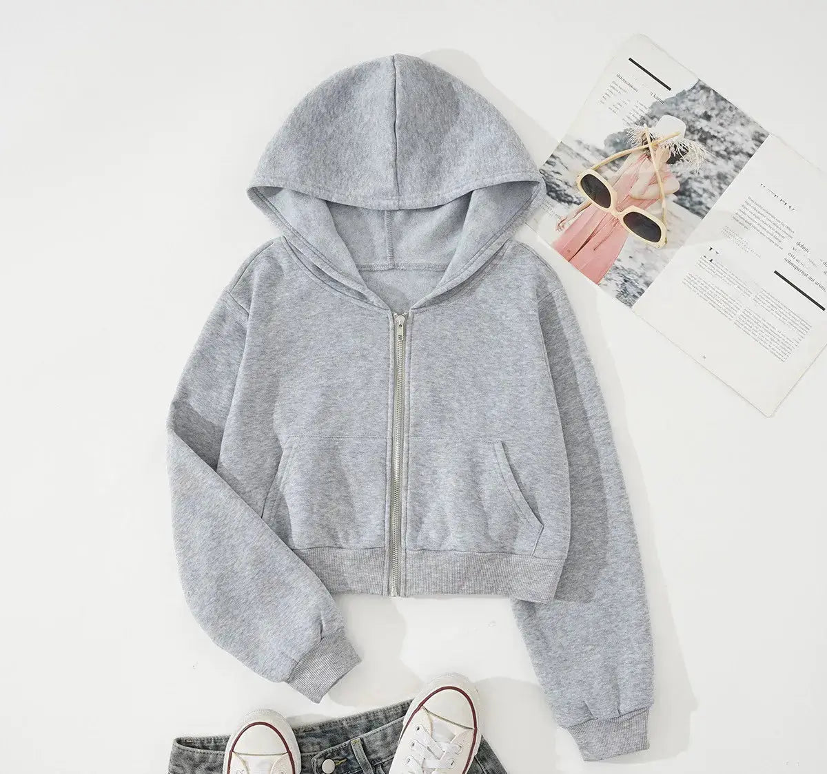 Black loose mesh hooded top by Hypes Inventory, breathable layering cover-up for women with a relaxed fit and net fabric design.