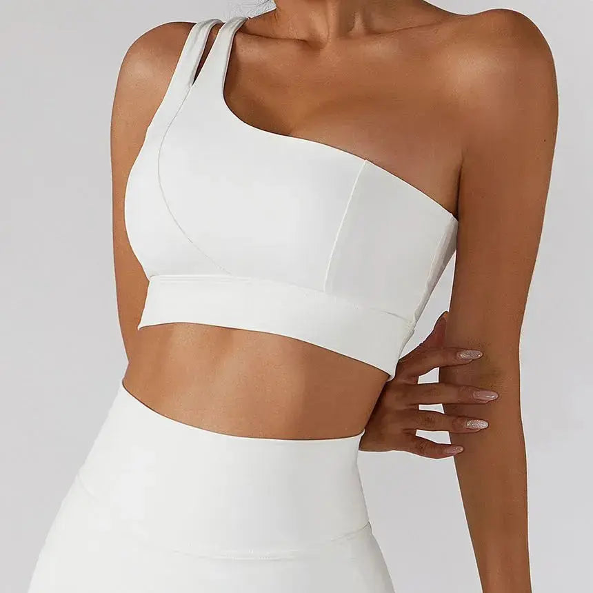 Hypes Inventory Flaire™ ribbed one-shoulder sports bra in black, featuring a fitted design and breathable fabric for active wear.
