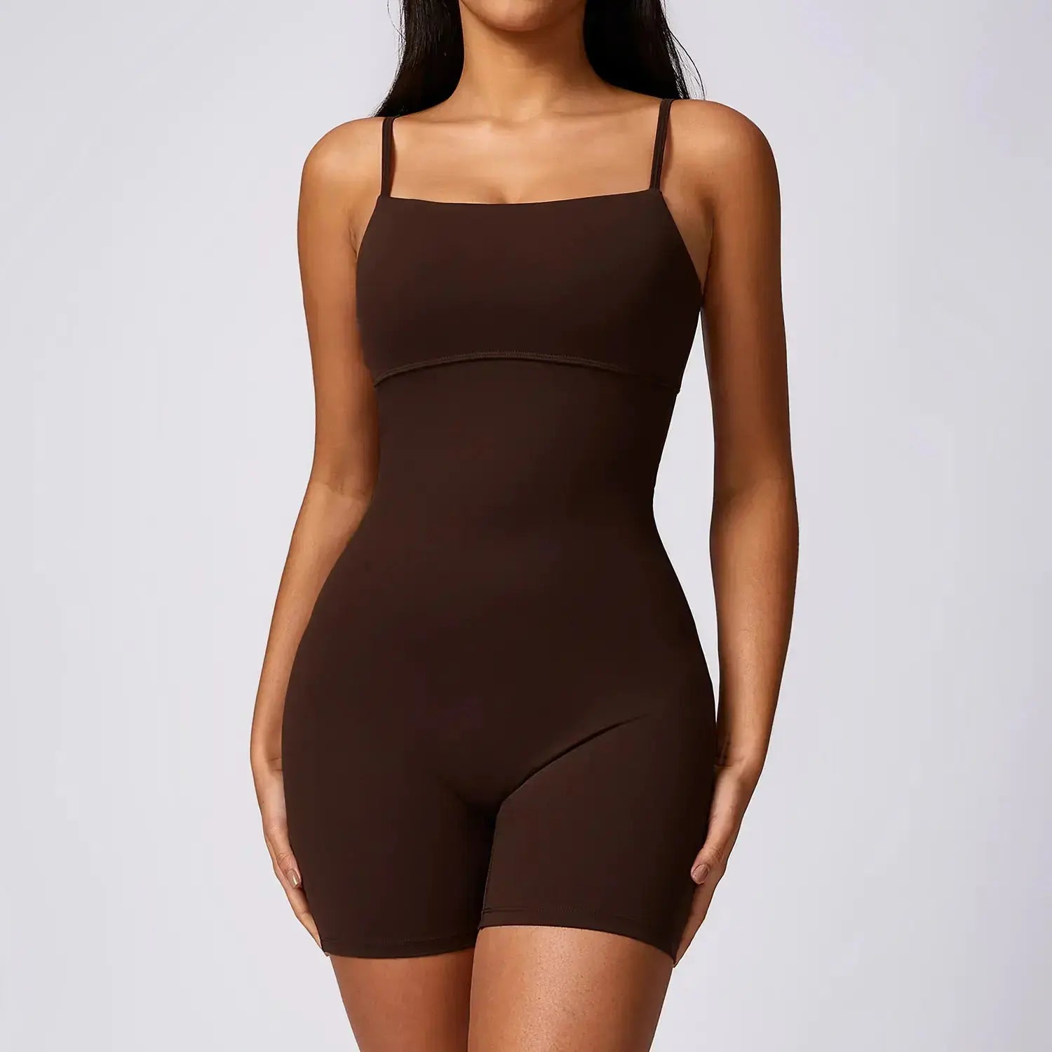 Black Flairé™ seamless yoga jumpsuit by Hypes Inventory, featuring a fitted, sculpting one-piece activewear design for women.