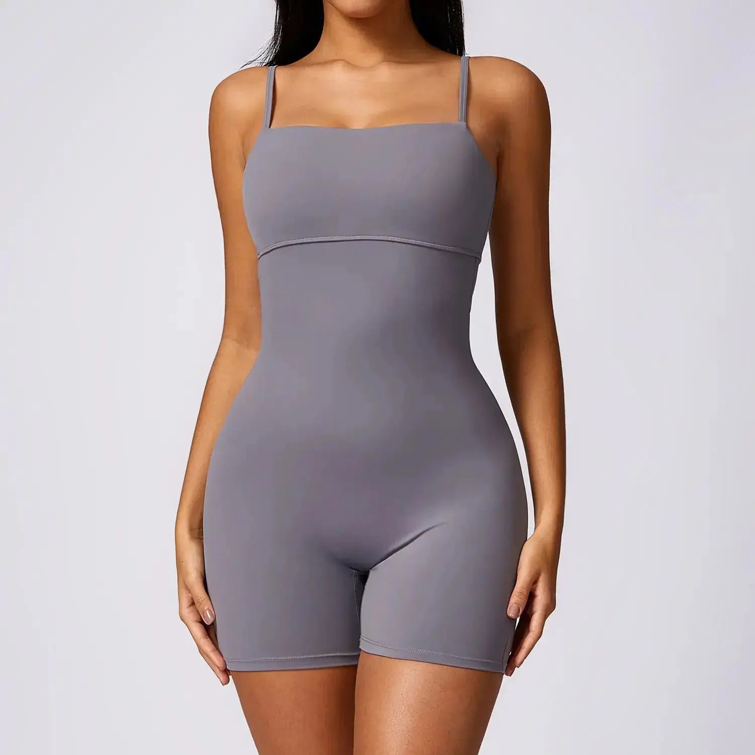 Black Flairé™ seamless yoga jumpsuit by Hypes Inventory, showing a fitted, sculpting one-piece activewear for women.