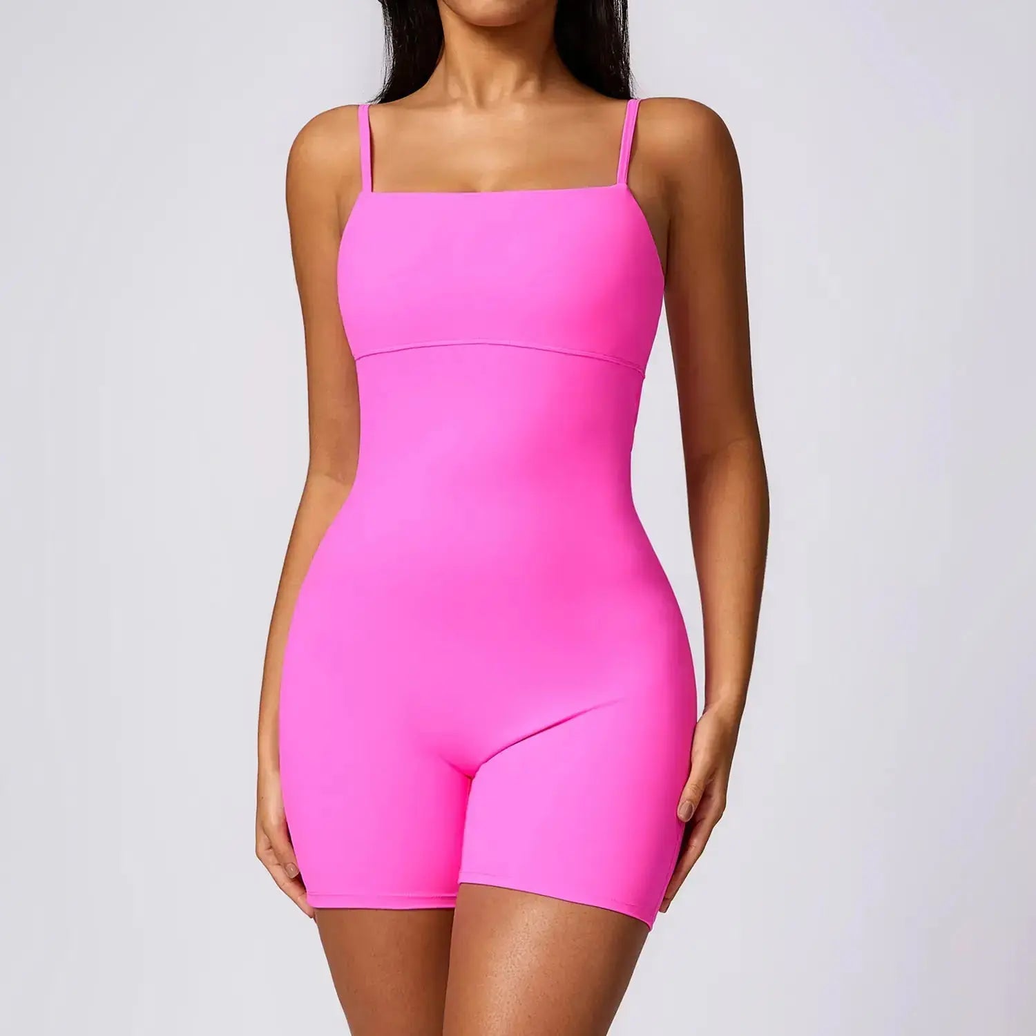 Black Flairé™ seamless yoga jumpsuit by Hypes Inventory, showing a close-up of the fitted, sculpting one-piece activewear for women.
