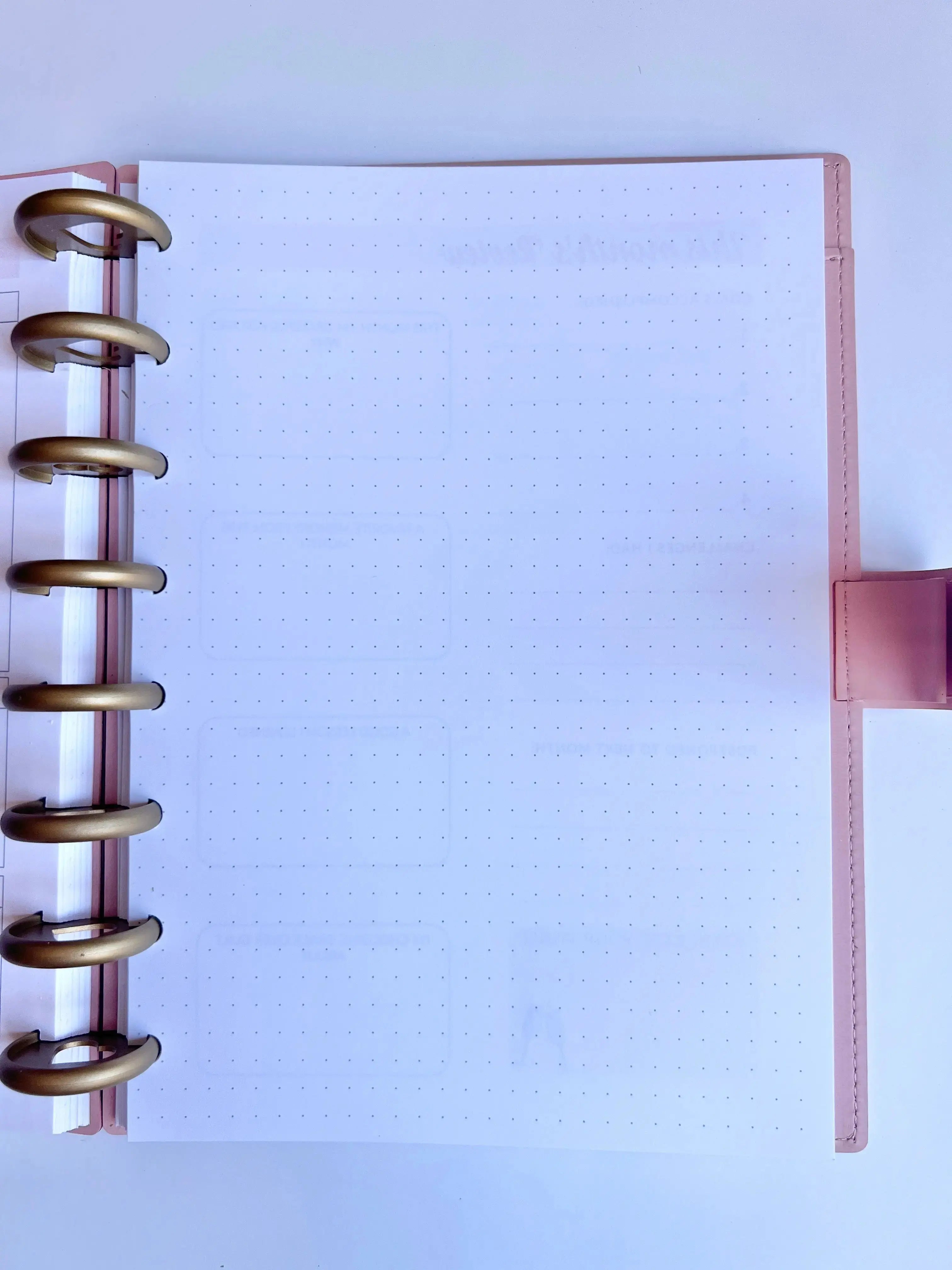 A5 Discbound 2026 Weekly and Monthly Planner Journal by The Fabulous Planner with colorful cover and lined pages inside.