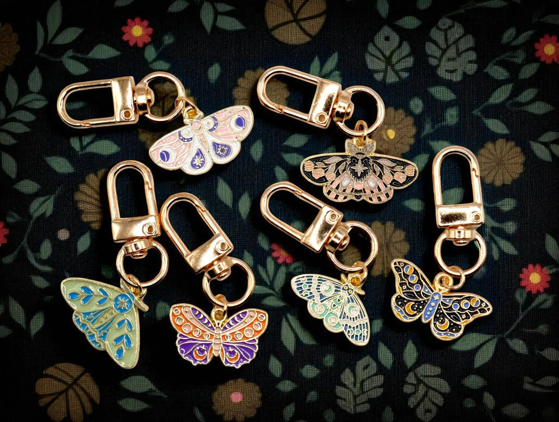 Celestial moth metal keychain and bag charm with butterfly design, from Why Begin, perfect as an aesthetic accessory.